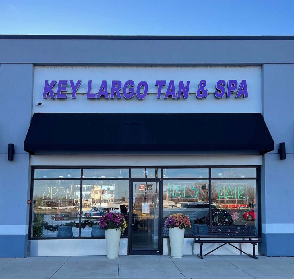 Exterior view of Key Largo Tan & Spa, showcasing the inviting storefront and signage in East Alton, IL.