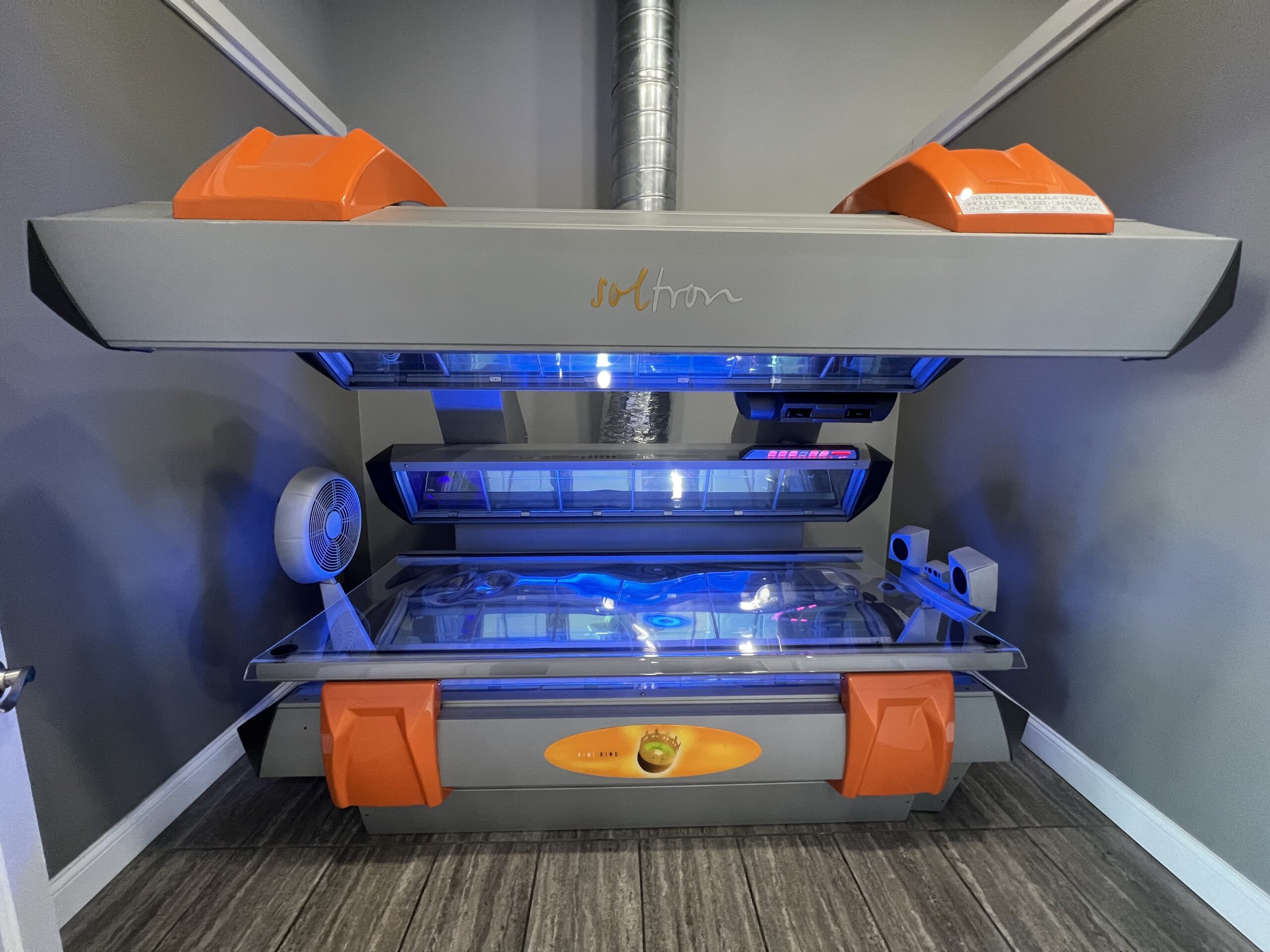 Modern Soltron tanning bed at Key Largo Tan & Spa in East Alton, IL, offering advanced tanning technology for optimal results.